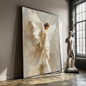 May include: Large framed canvas art featuring an angel with large white wings and a flowing white gown. The painting has a neutral color palette with beige and gray tones. A classical statue stands nearby.