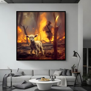 May include: A small, white lamb stands in a field with a fire burning in the background. The lamb is looking directly at the camera.