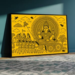 May include: Framed artwork with a yellow backdrop and black line art. It shows a deity in a chariot drawn by horses, with clouds, birds, and an elephant. The artwork is framed with a black border.