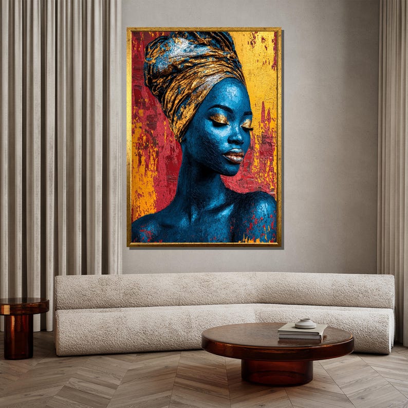 May include: A framed portrait of a woman with blue skin and gold accents. She wears a gold head wrap and has gold eyeshadow and lipstick. The background is a mix of red, yellow, and gold, with a gold frame.