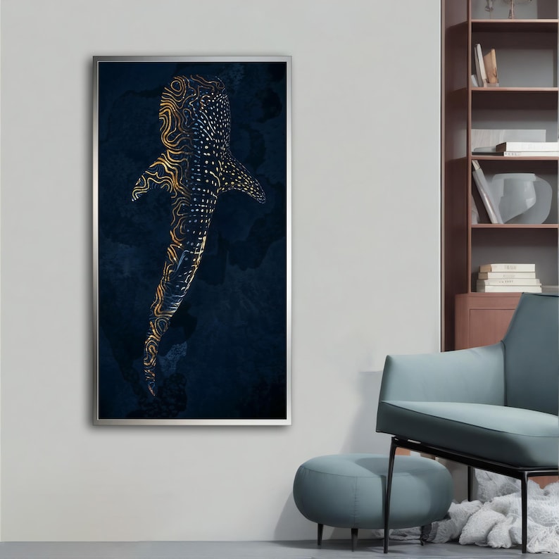 May include: A framed print of a whale shark with gold and black patterns on a dark blue background.