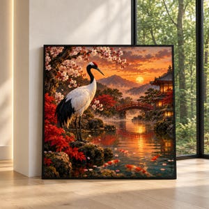 Puede incluir: Un cuadro cuadrado de pared que muestra una grulla de corona roja sobre una roca junto a un estanque con peces koi. La escena incluye un puente arqueado rojo, una pagoda, flores de cerezo y montañas bajo un cielo de atardecer naranja.