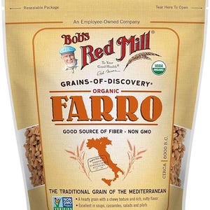 May include: A packet of Bob's Red Mill organic farro, with the text "Grains-of-Discovery" and "Good Source of Fiber." The net weight is 680g. The product is the traditional grain of the Mediterranean. The package is resealable.