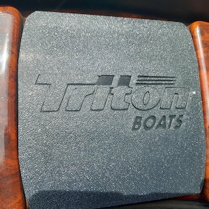 May include: A rustic wooden sign with the text "Welcome to our home" in white lettering. The sign features a distressed finish and a simple, inviting design, perfect for entryway decor.