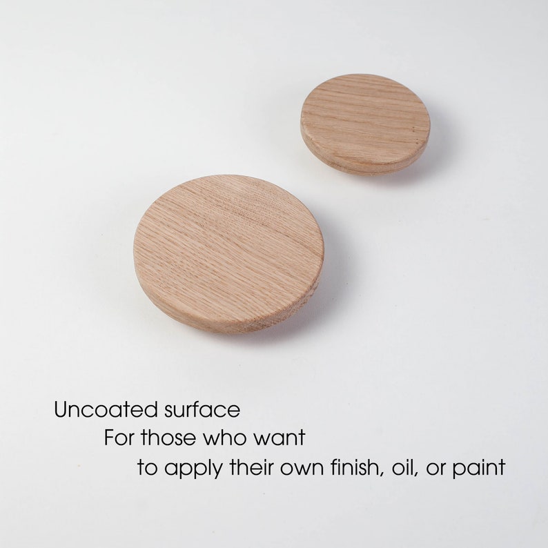 May include: Two uncoated wooden circles, one larger than the other, on a white background. The text "Uncoated surface" is below the circles, followed by "For those who want to apply their own finish, oil, or paint."