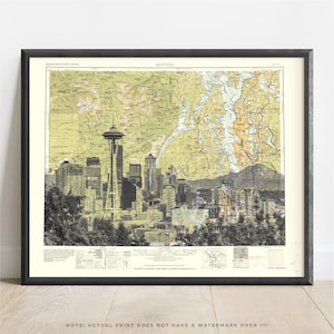 May include: Framed print of a map of Seattle, Washington, featuring a black and white skyline view. The map has a vintage aesthetic with tan and green tones. The Space Needle is a prominent landmark in the city's skyline.