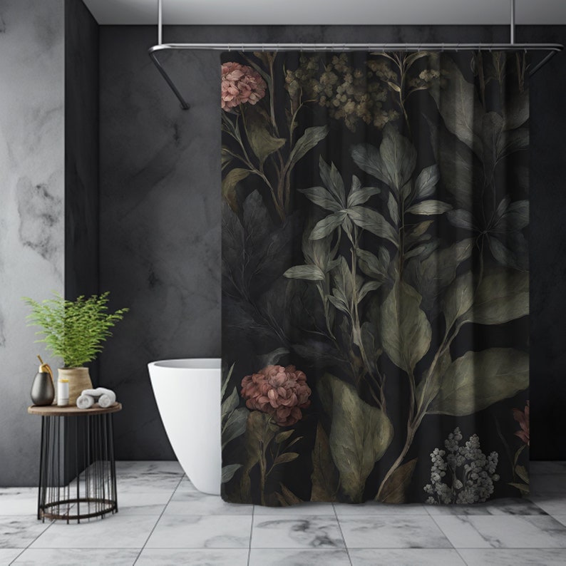 May include: A dark shower curtain featuring a botanical design with large leaves and flowers in shades of green, pink, and brown. The curtain is hanging in a modern bathroom with a white tub and a small side table.