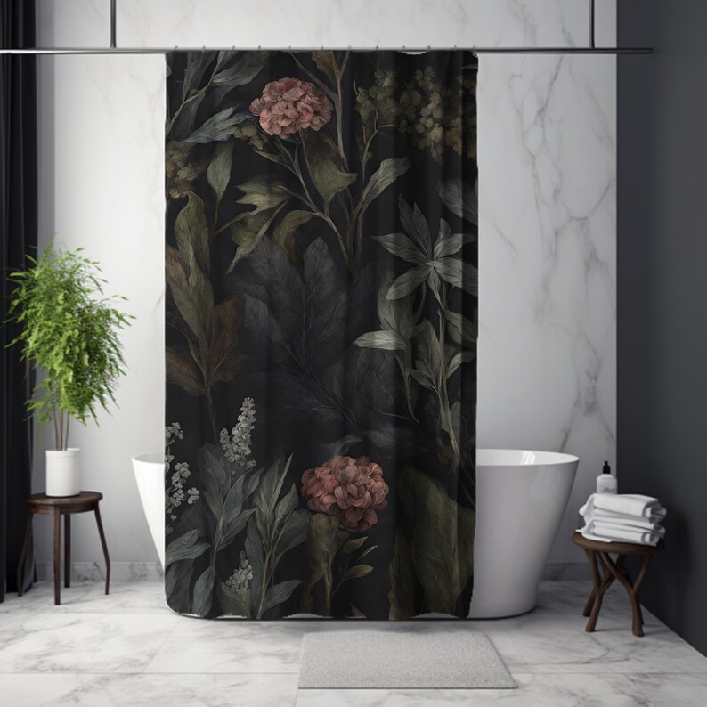 May include: A dark shower curtain featuring a botanical design with large leaves and flowers in shades of green, brown, and pink. The floral pattern is set against a black background. The curtain is hanging in a bathroom with a white tub and marble tile.