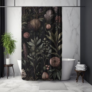 May include: A black shower curtain with a floral pattern featuring pink, green, and white flowers and leaves. The shower curtain is hanging in a bathroom with a white bathtub and a wooden stool.