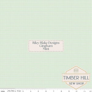 May include: Mint green gingham fabric with a small check pattern. The fabric has the text "Riley Blake Designs Gingham Mint" and the Timber Hill Sew Shop logo. The fabric is measured in inches.