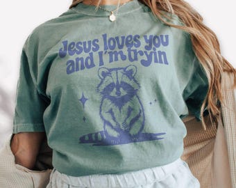 Christian Comfort Colors T-shirt, Funny Racoon Shirt, Jesus Loves You and I'm Tryin Graphic Tee, Bible Verse Gift, Retro Religious Apparel