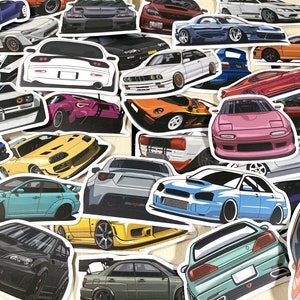 May include: A collection of colorful car stickers featuring various makes and models. The stickers are printed on white paper and have a glossy finish.