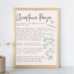 May include: A printable poster with a light pink background and a watercolor design of eucalyptus leaves. The poster features a quote about acceptance and prayer. The text reads: "Acceptance Prayer. Acceptance is the answer to all my problems today. When I am disturbed, it is because I find some person, place, thing or situation-some fact of my life- unacceptable to me, and I can find no serenity until I accept that person, place, thing or situation as being exactly the way it is supposed to be at this moment. Nothing, absolutely nothing, happens in God's world by mistake. Until I could accept my alcoholism, I could not stay sober; unless I accept life completely on life's terms, I cannot be happy. I need to concentrate not so much on what needs to be changed in the world as on what needs to be changed in me and my attitudes."
