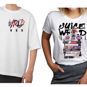 May include: Two white t-shirts. One features the text "WRLD" in colorful graffiti style with "999" below. The other shirt displays "Juice WRLD" in black graffiti with an image of a person sitting on cassette tapes.