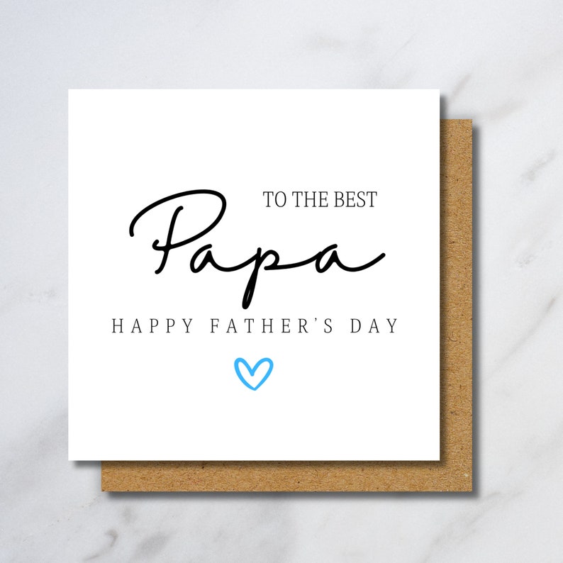 Puede incluir: Una tarjeta blanca con texto negro que dice "To the best Papa Happy Father's Day" con un coraz&oacute;n azul.