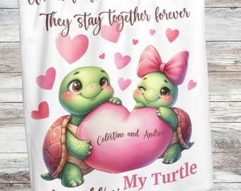 May include: A white fleece blanket with a pink heart and two green turtles holding the heart. The turtles have pink bows and hearts around them. The text on the blanket reads "When turtles find their mate, they stay together forever."  "Celestine and Andrew" is written on the heart.  "You are... My Turtle" is written below the turtles.  "Cute and sentimental!" is written at the bottom of the blanket.