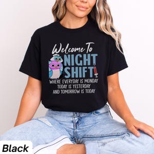 May include: Black t-shirt with a graphic of two owls and the text "Welcome To Night Shift" with the tagline "Where everyday is Monday, today is yesterday and tomorrow is today".
