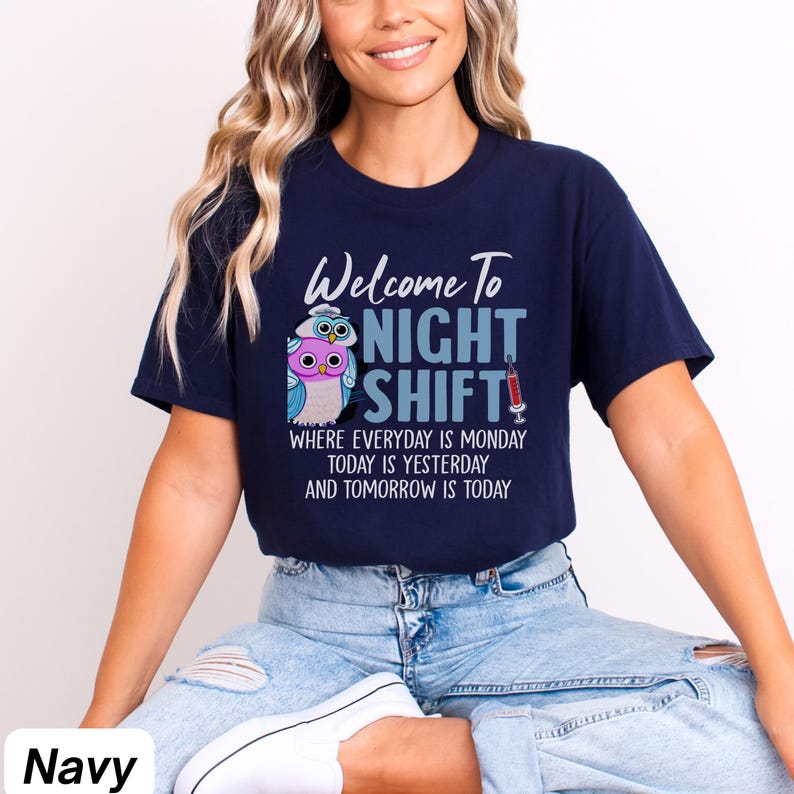 May include: A navy blue t-shirt with a graphic of two owls and the text "Welcome To Night Shift" with the tagline "Where everyday is Monday, today is yesterday and tomorrow is today".