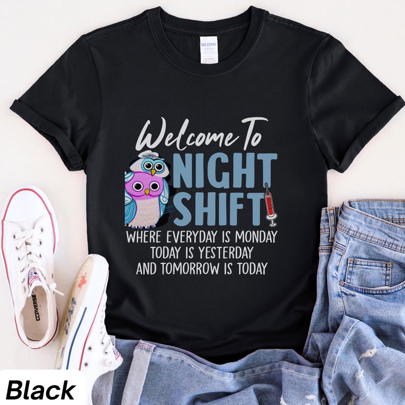 May include: Black t-shirt with a graphic of two owls and the text "Welcome to Night Shift" with the tagline "Where everyday is Monday, today is yesterday and tomorrow is today".