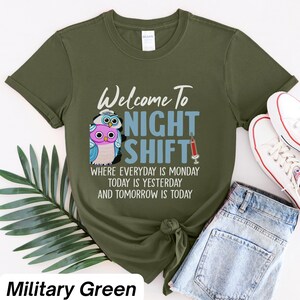 May include: A green t-shirt with a graphic of two owls and the text "Welcome to Night Shift" with the text "Where everyday is Monday, today is yesterday and tomorrow is today".