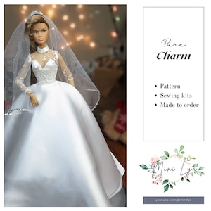 Peut inclure: Une robe de mariée blanche avec un long voile et des détails en dentelle. La robe a un corsage ajusté et une jupe ample. L'image comprend également du texte qui dit "Pure Charm" et "Patron, Kits de couture, Fait sur commande".
