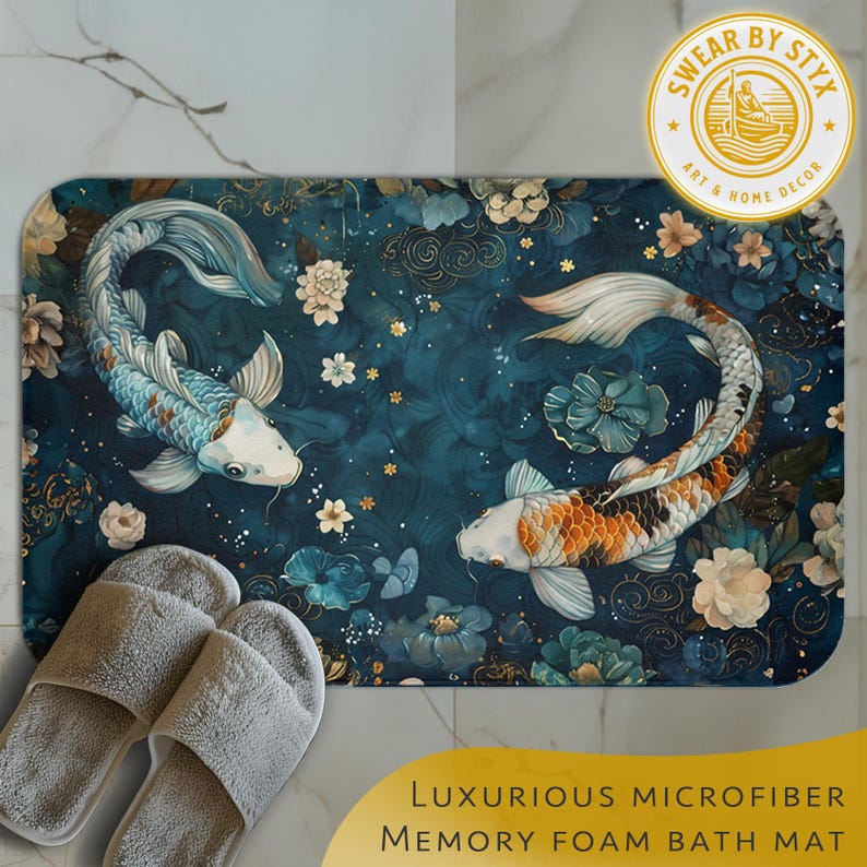 May include: A blue and gold bath mat with a luxurious microfiber texture and memory foam backing. The mat features a design of two koi fish swimming in a pond with floral accents. The text "SWEAR BY STYX ART & HOME DECOR" is printed in gold on a white circle.