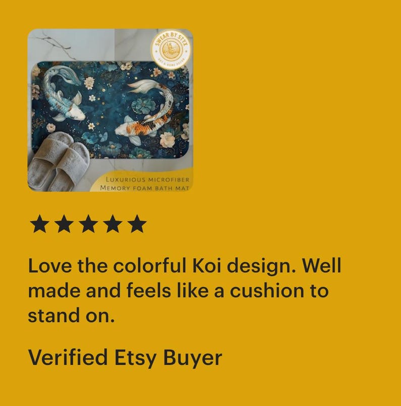 May include: A blue bath mat with a colorful Koi fish design. The mat is made of microfiber and has a memory foam backing. The text "LUXURIOUS MICROFIBER MEMORY FOAM BATH MAT" is printed on the mat.
