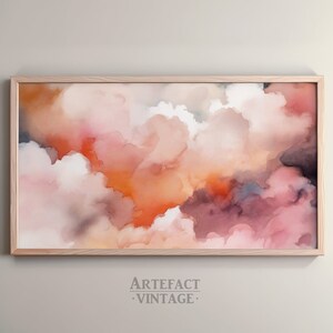 May include: Abstract watercolor painting in shades of pink, orange, and purple. The painting depicts a cloudy sky with a soft, ethereal feel.