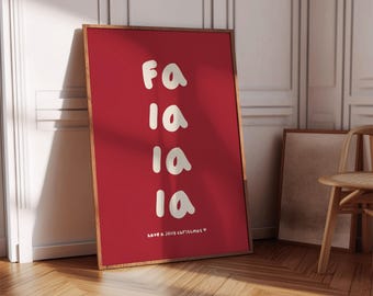 May include: A framed red poster with the words "Fa la la la la" in white, handwritten-style font. The phrase "have a jolly christmas" is at the bottom. The frame is a light brown color.