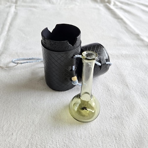 Leather case with narrow medieval glass