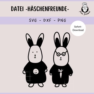 K&ouml;nnte beinhalten: Schwarz-wei&szlig;-Illustration von zwei Kaninchen, die schwarze Hemden tragen. Ein Kaninchen hat ein Smiley auf seinem Hemd und das andere eine Karotte.