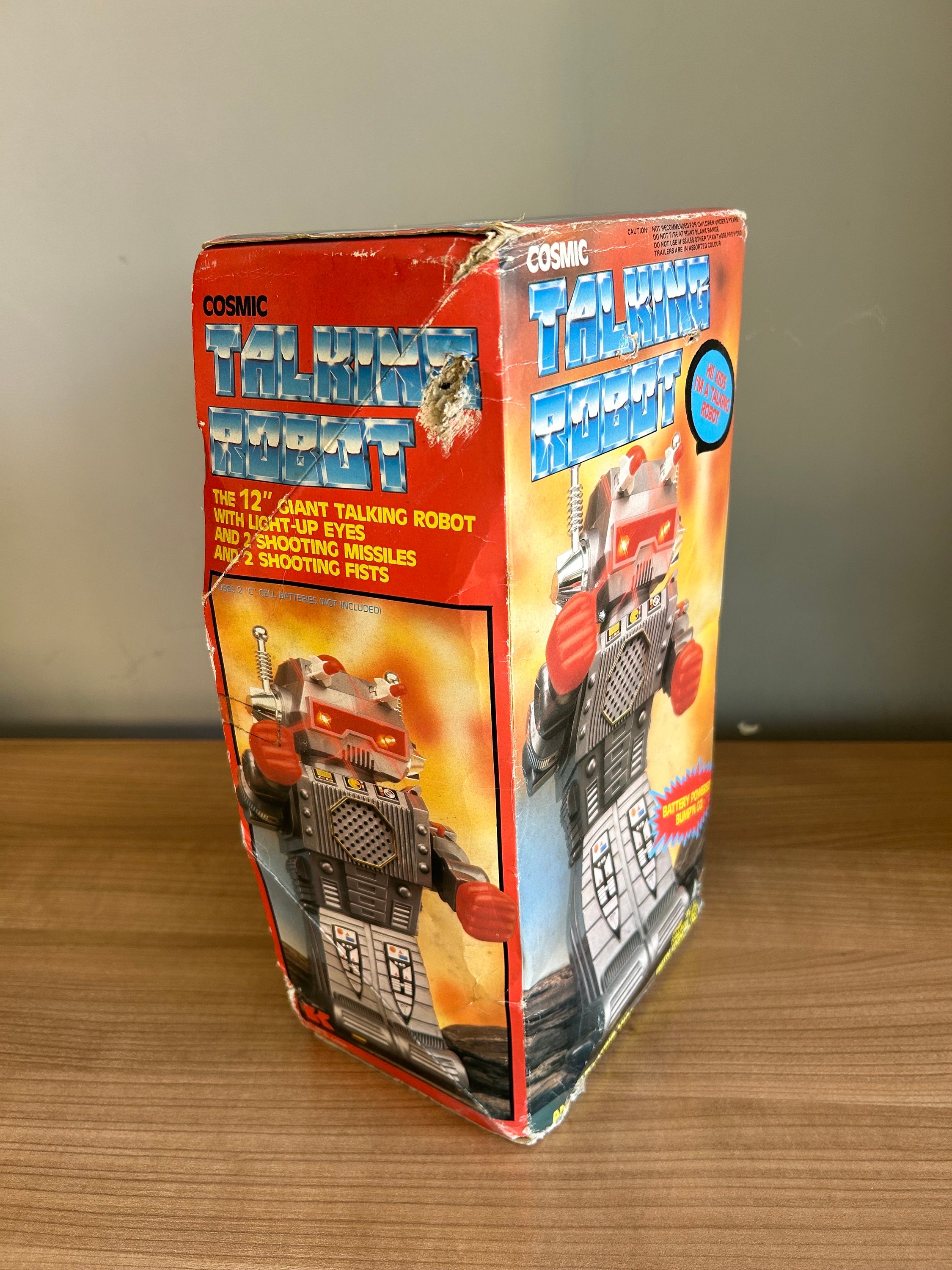 Cosmic Talking Robot From the 80s, Talks When You Press Its Head