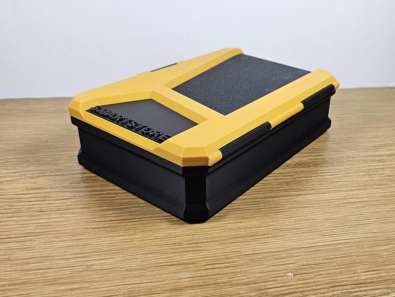 May include: A yellow and black storage box with the text "SMART STORAGE" printed on the top.