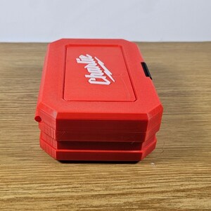 May include: A red plastic tool box with the word "Craftsman" printed in white on the top. The box has a black latch.