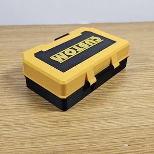 May include: A small yellow and black plastic toolbox with the word "CUSTOM" printed on the lid.