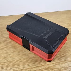 May include: A red and black plastic storage box with the text "SMARTSTORE" printed on the top.