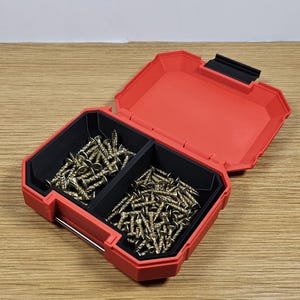 May include: A red plastic storage box with two compartments filled with gold screws.