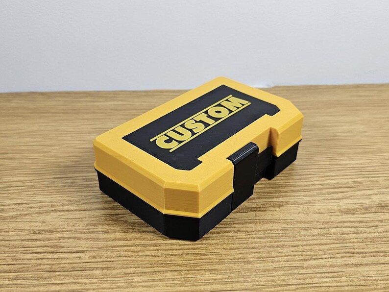 May include: A yellow and black plastic storage box with the word "CUSTOM" printed on the top.