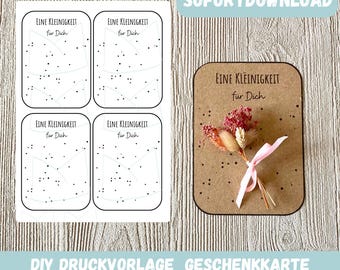 May include: Printable gift card template with the text "EINE KLEINIGKEIT FÜR DICH" (A small thing for you) and a dotted line design. The template is shown on a brown background with a small bouquet of dried flowers.