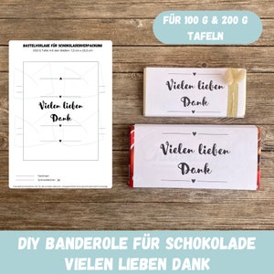 May include: Printable template for a chocolate bar wrapper with the text "Vielen lieben Dank" (Many thanks) in black lettering on a white background. The template is designed for 100g and 200g chocolate bars.