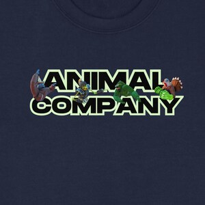 May include: Navy blue sweatshirt with the text "ANIMAL COMPANY" in white with a green outline. The letters have cartoon animal illustrations. A long-sleeved, crew neck sweatshirt.