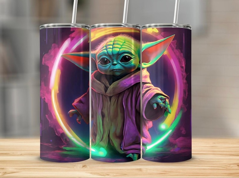 May include: A stainless steel tumbler featuring a colourful image of a green alien character with large ears, wearing a purple robe. The background is a dark purple with a neon pink and green ring around the character.
