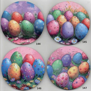 May include: Four round plates with a pink background and a design of colorful Easter eggs with different patterns. The plates are numbered 144, 145, 146, and 147.