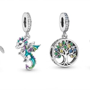 May include: Four sterling silver charms featuring a green enameled turtle, a teal and purple dragon, a circular tree of life with multicolored stones, and a highland cow wearing a green hat and holding a shamrock, all with 925 silver stamps.