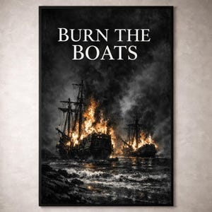 May include: A framed print showing two burning ships on a stormy sea. The image is predominantly monochrome, with vibrant orange and yellow flames. The words "BURN THE BOATS" are displayed in white at the top.