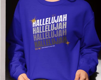 May include: Royal blue sweatshirt with the word "Hallelujah" stacked in white and silver text. The design includes a gold starburst and the phrase "Sing Praise to the Lord".
