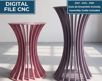 May include: A digital file for a CNC machine to create a pedestal table, featuring two hourglass-shaped tables with vertical slats. The text includes MESA PEDESTAL / PEDESTAL TABLE, DIGITAL FILE CNC, DXF - SVG - PDF, and Assembly Guide Included.