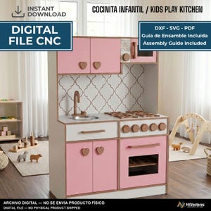 May include: A digital file for a CNC kids play kitchen featuring pink cabinet doors with heart-shaped handles, a white countertop, a sink, a stove with knobs, and an oven. The text reads: COCINITA INFANTIL / KIDS PLAY KITCHEN, DIGITAL FILE CNC, DXF - SVG - PDF, Guía de Ensamble Incluída, Assembly Guide Included.