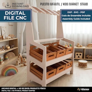 May include: A light-colored wooden kids market stand featuring two tiers of angled shelves, each holding three rectangular wooden crates. The structure includes a top canopy frame and text reading PUESTO INFANTIL / KIDS MARKET STAND, DIGITAL FILE CNC, DXF - SVG - PDF, Guía de Ensamble Incluída, Assembly Guide Included.