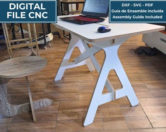 May include: A white wooden work table with a flat rectangular top and A-frame legs, featuring a laptop and a computer mouse on its surface. The image includes text overlays stating Digital File CNC, Mesa de Trabajo, and Assembly Guide Included.